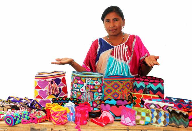 Sunilda Uriana Wayuu Artisan Weaver With her products - Tejidos Vitales Project Riohacha, La Guajira Colombia fair trade with