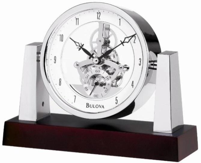 Skeleton movement with seconds sub-dial. Protective glass lens. H: 6 inch W: 7.