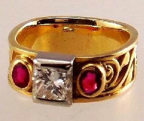 Lot # 431 431 18kt yellow gold diamond and ruby ring.