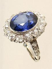 $350 - $450 14K gold ring with diamonds and sapphire.