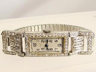 552 553 Lot # 535 535 536 537 Ladies Cyma diamond case wristwatch. $850 - $950 Victorian silver keywind pocket watch with key, London 1850. Three watches Omega, Elgin and Bulova.
