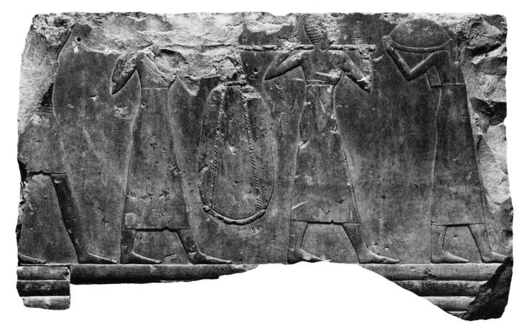 8a, b. Bas-relief of offering bearers. Tomb chapel of Queen Nofru at Deir el Bahri. Excavations of the Metropolitan Museum of Art.