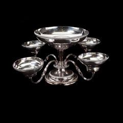 417 Silverplate Epergne. Central round silverplate weighted base, with four rotating arms, each with a bowl and a candle holder, and a large central bowl.all rims with beading and gadrooning.