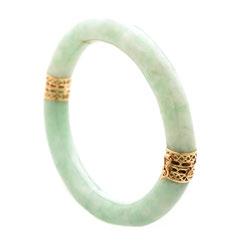 5 x 16 mm, set in an 18k yellow gold mounting. {Size: 5, Gross Weight: 4.2 dwts} 71 Sold $840.00 72 Jade, 14k Yellow Gold Bracelet.