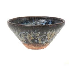 194 Two Black Glazed Ceramics Song Dynasty Comprising a Cizhou type black glazed tea bowl and a circular black glazed lidded box with an inscription.