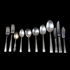 Knives, Master Butter Knife, Pickle Fork, Pie Server, Ladle, Jelly Spoon, Sugar Shell, Sugar Tongs. {Total weighable silver 52.454 troy oz.} 387 Sold $720.
