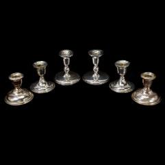 Comprising Two Round Sterling Compotes, One with Reticulated Rim, and Three Pairs of Round Sterling Candlesticks.