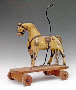 Lot 452 Lot 452 19th Century carved and painted pushalong toy horse having a wrought iron handle and platform base, height to top of handle 59cm 400-600 (+ 24% BP*) Lot 454 Lot 454 Early 20th Century