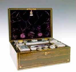 Silver & White Metal Lots 519-568 Lot 519 Lot 519 Victorian brass bound and inlaid coromandel travelling toiletry box, the hinged cover opening to reveal a purple velvet lined