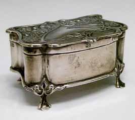 Lot 534 Lot 534 Edward VII silver trinket box having embossed stylised foliate decoration and standing on four