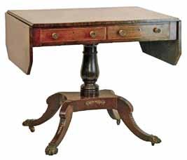 fitted two real and two dummy drawers and standing on a turned pillar and platform quadripartite base with splayed feet having hair claw