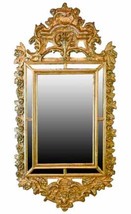 wide 2000-3000 (+ 24% BP*) Lot 88 Lot 88 Antique Italian giltwood and gesso wall mirror, the plate with eight conforming surrounding mirrored panels, shell and foliate carved pediment and