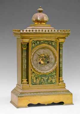 Lot 106 19th Century French brass cased mantel clock of Egyptian influenced architectural design, the case surmounted with a dome on a stepped base, silvered dial with Roman numerals set