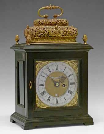 brass and ebonised basket top bracket clock by John Shaw of Holborn, the brass basket top having a cast handle and pierced and figural decoration, four conforming pineapple finials, brass dial with