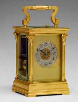 Lot 117 Lot 117 Large satin brass cased repeat carriage clock, the silvered dial with Arabic numerals and set within a gilt mask, Corinthian column to each corner, movement striking on a gong, 14.