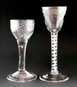 Lot 293 Two wine glasses, the first with pointed round funnel bowl, stem with opaque spiral band outside a pair of spiral tapes and