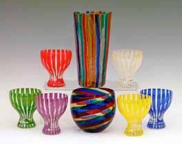 designed by Gio Ponti, 15cm high, a Venini glass bowl with diagonal multi coloured stripe decoration, base with paper label, 8.