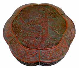 Lot 379 Lot 379 Antique Chinese cinnabar lacquer shaped circular box and cover, having central relief decoration depicting buildings in a landscape within a surround of six reserves, each decorated