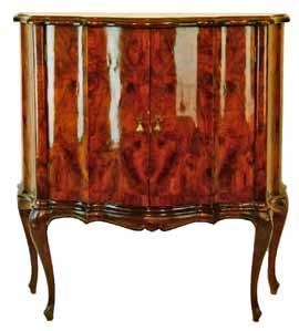 Lot 9 Lot 6 Lot 6 Early 19th Century Italian walnut serpentine front two door cupboard standing on carved cabriole supports, 92.