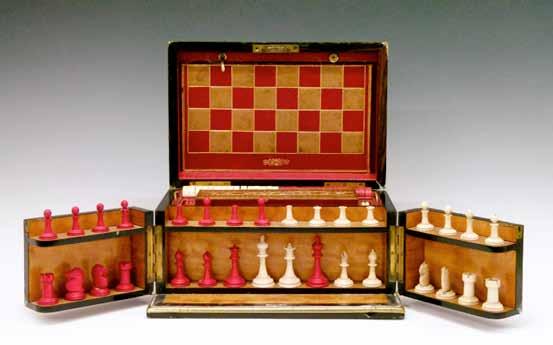 25cm, in a later oak frame 50-80 (+ 24% BP*) Lot 428 Victorian coromandel cased games compendium, the hinged cover and doors opening to reveal a satinwood fitted interior with bone chess set,