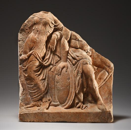 AN ANTEFIX WITH VENUS AND MARS. H. max. 27 cm. Terracotta. An antefix with a relief depicting the divine lovers Mars and Venus.