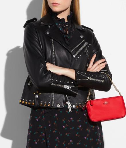 COACH x SELENA THE COLLECTION Selena worked with the design team on this collection of covetable SLGs and key fobs made to shine along with the Selena Grace or on their own.