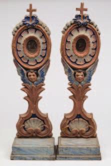 250-350 813 813 A pair of Italian carved and painted word reliqueries the oval glazed cartouche within a flowerhead border,