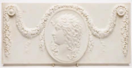 845 A carved marble plaque the oval chartoche decorated with the head of Medusa draped with a ribbon tied garland, possibly a fireplace panel, 20 x 42cm 846 An antique carved oak panel the central