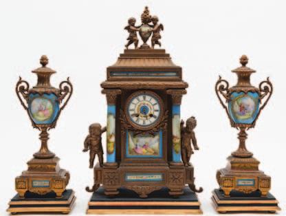 cartouches and with blued steel hands, the tortoiseshell and engraved brass inlaid decoration with gilt-metal mounts and surmounted by a gilt-metal basket of fruit, height 30cms.