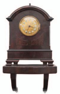 the centre, black Arabic numerals to the individual enamel roundels and blued steel moon hands, the mahogany break-arch case with walnut panels set below the dial, standing on bracket feet, complete