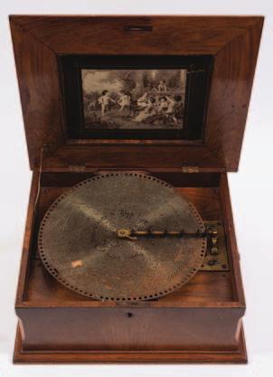Mordan & Co, London, with assorted graduated brass weights, mounted on a rectangular mahogany base, 33cm. wide 100-150 714 A late 19th century table top polyphon playing 40cm.