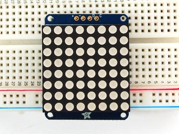 Place a 4-pin piece of header with the LONG pins down into the breadboard.