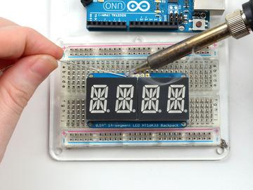 Solder all 5 pins! That's it! now you're ready to run the firmware on your Arduino! Downloading the Arduino Library We wrote a basic library to help you work with the alphanumeric backpack.