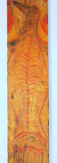 This paddle is carved from a single length of wood. There is a face carved on one side of the handle.