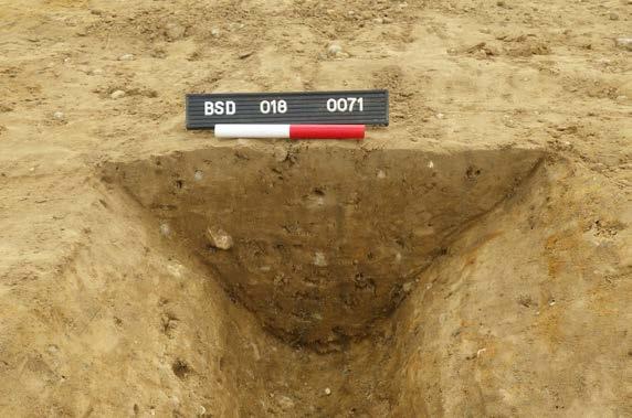 be a natural/glacial hollow filled with a homogenous, sterile subsoil. A large rim and shoulder sherd from an Early-Middle Iron Age bowl was found on the surface of this layer.