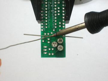 Turn the PCB over and solder both legs