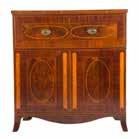 FURNITURE 1168 Late Federal mahogany flip-top games table Boston, MA, early 19th century; hinged lid with canted corners, foliate carved standard with four reeded splayed legs, brass fillets and