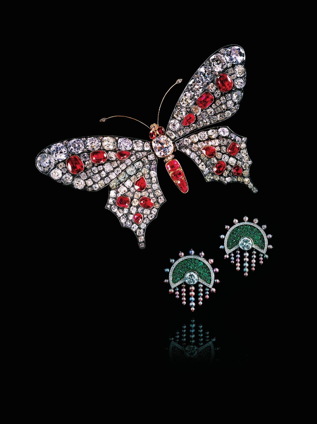 Faerber Butterfly brooch. GEM GENEVE: DAWN OF A NEW ERA Oselieri Racine earrings with diamonds, emeralds and natural pearls set in white and blackened gold.