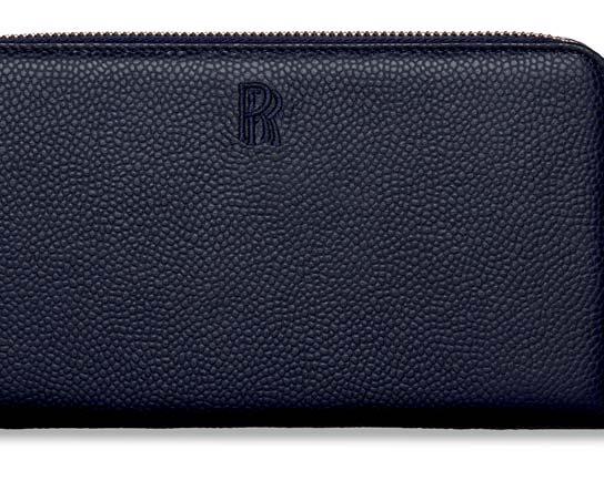 The purse is also available in navy leather with a contrasting