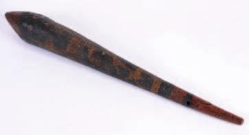 557. A North American Indian club, the pointed end and tapering body with remains of painted decoration