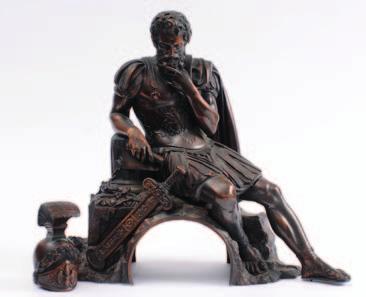 577. A bronze study of the Roman Emperor Justinian, seated beside a ruined column with sheathed sword