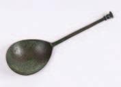 handle to the reverse, 21cm. high. 200-300 612. A 16th century bronze seal top spoon, with pear-shaped bowl on a canted angle stem and seal top, 15cm. long, maker s mark worn. 200-250 613.