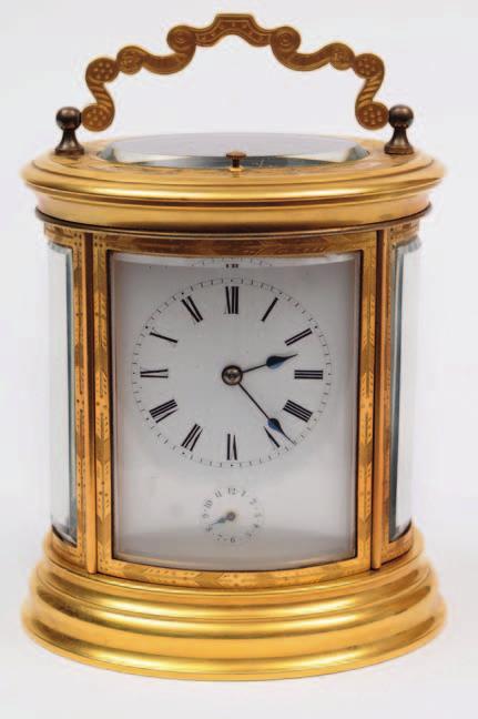 615. A mid-victorian French engraved oval carriage clock having an eight-day duration movement with cylinder escapement, striking the hours and half-hours on a bell with push repeat and alarm, the
