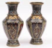 510. A pair of unusual Japanese cloisonne vases of hexagonal baluster form each decorated overall with panels and borders of birds, flowers and foliage on multicoloured and aventurine grounds, the