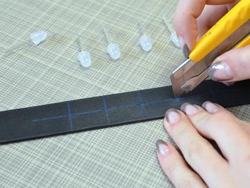 Use a utility knife to cut small horizontal slits in the collar at