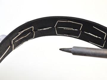 Solder overlapping wire leads while the collar is curved, using a pair