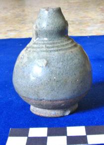 12, 13) that were dated to the late 15th to mid-16th centuries, the Late Si Satchanalai brown glazed jarlets