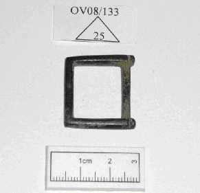 Candidate No: 63702 3. 0V081133125 - A buckle, square with an indented line to one end. To the other end there is a small worn area, indicative of a buckle bar which has been lost. lt is complete.