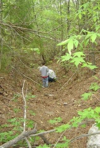 The original mined area is an open trench about 100 feet long with dump areas immediately adjacent to the trench. The trench, which is still visible, is about 10 feet deep and about 20 feet across.