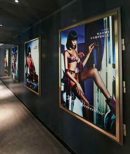 Posters in changing rooms and visual-merchandise displays in Lingerie ensure that brands are visible at key decision-making moments.